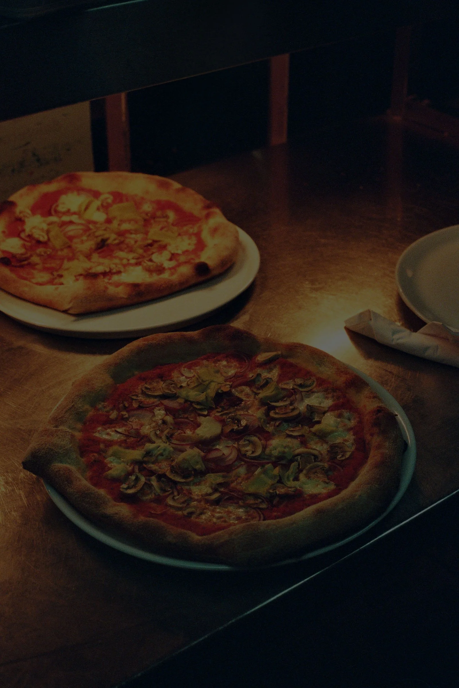 Two Ray's pizzas fresh out of the oven